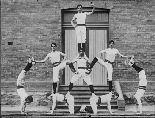 Stacking illustrated. “Human pyramid formed by members of the Ebenezer Gym Club”, ca. 1920–1930. Made available by State Library Victoria at http://handle.slv.vic.gov.au/10381/24949. Free of known copyright restrictions.